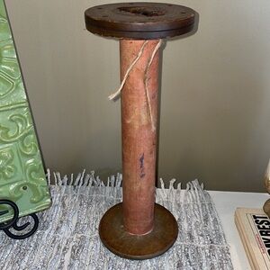 Very old wooden industrial thread spool